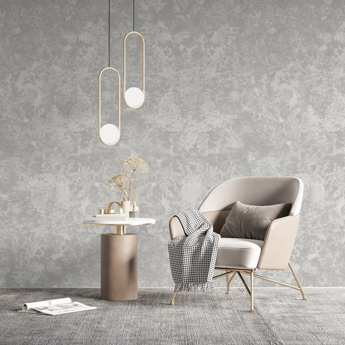 Textured wallpaper behind an armchair and pendant lights